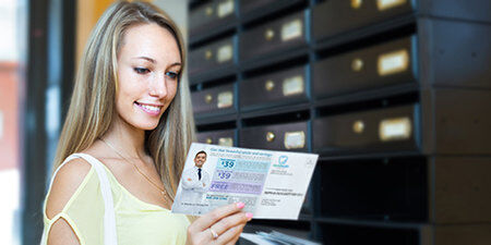 girl reading a postcard mailed to her